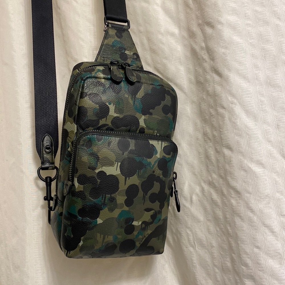 Like new unisex Coach sling backpack.